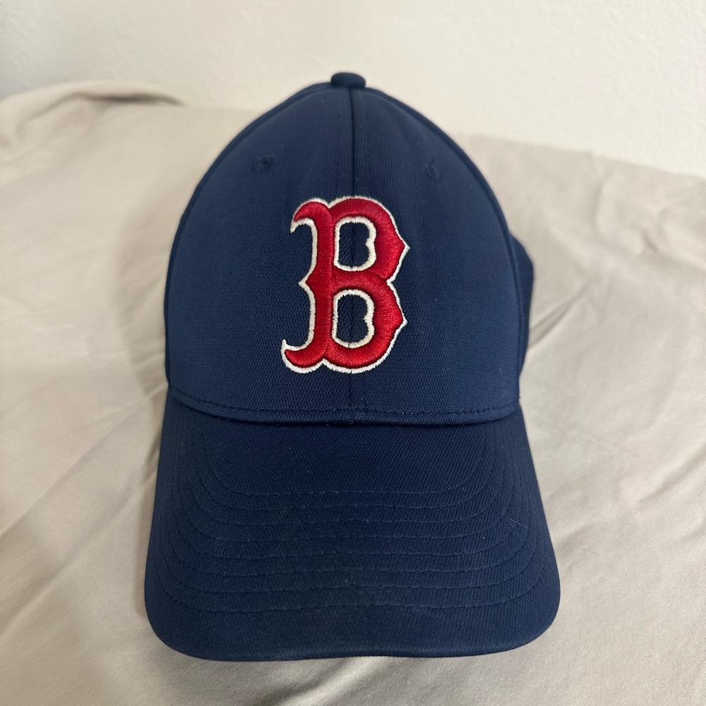 Boston Red Sox baseball cap.